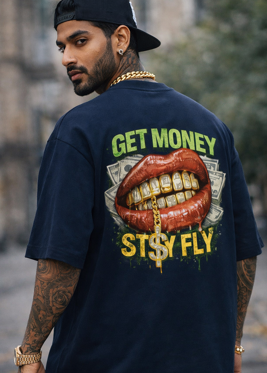 Man wearing a navy blue t-shirt with a graphic design on the back, featuring text and a mouth with gold teeth.